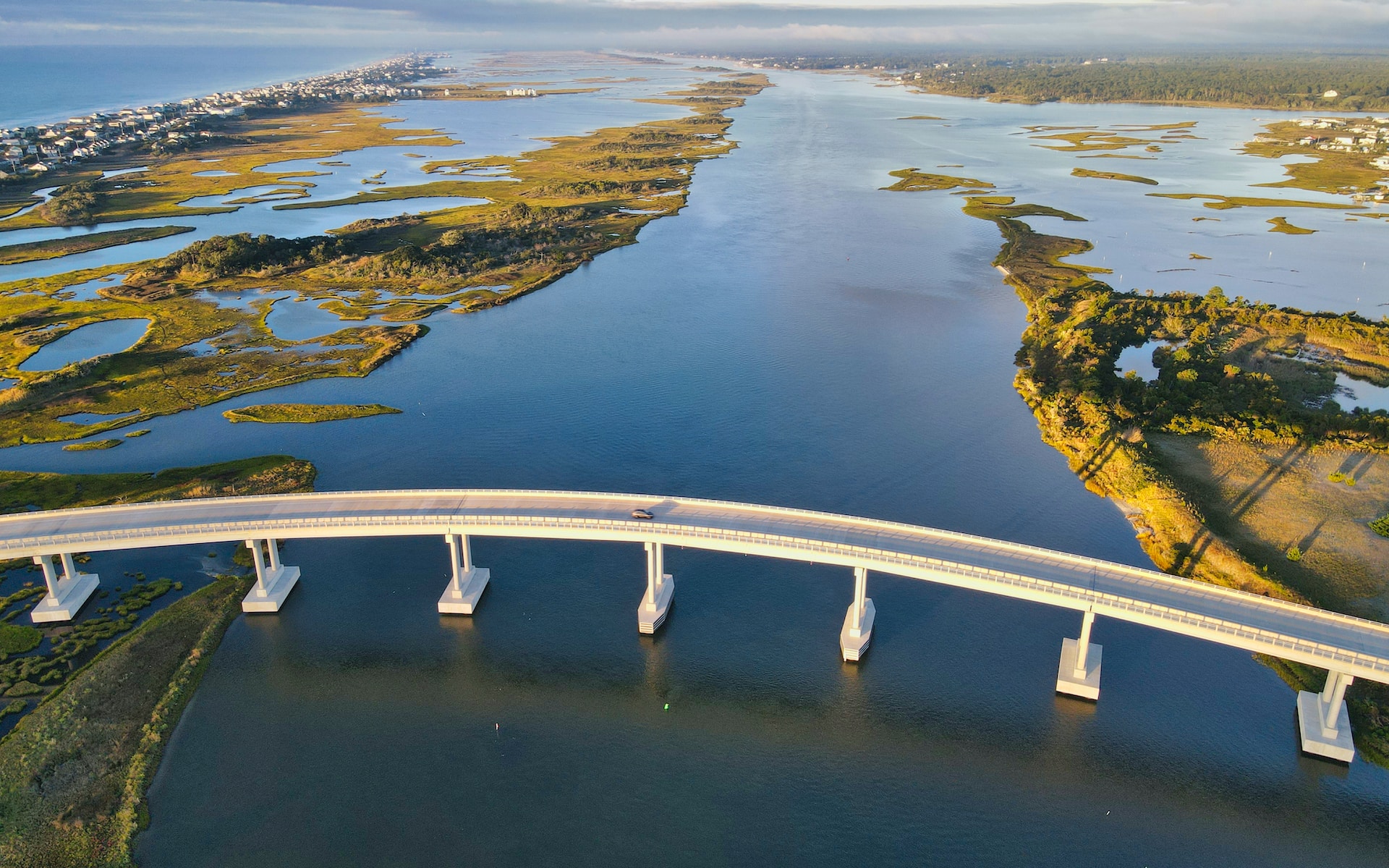 An aerial view of a bridge over a body of water